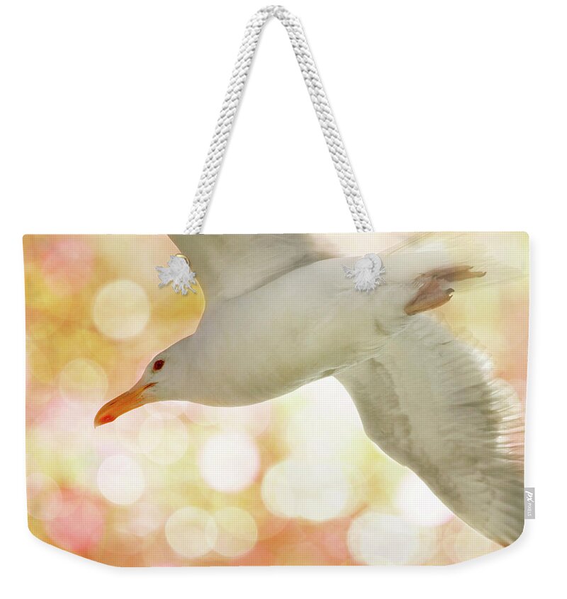 Seagull Weekender Tote Bag featuring the photograph Seagull on Pink and Yellow Sky by Peggy Collins