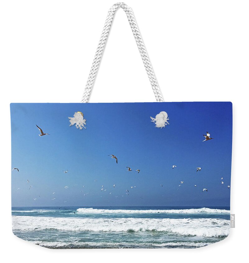 Seagulls Weekender Tote Bag featuring the photograph Seagulls and Wave by Cheryl Del Toro