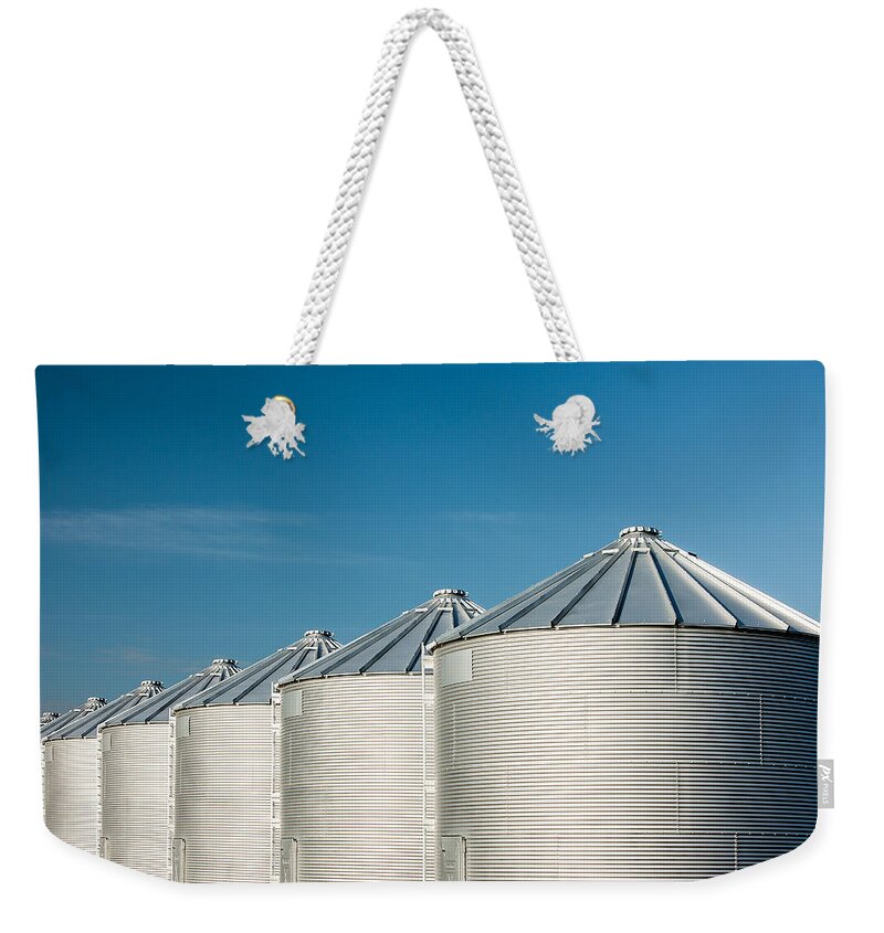 Grain Bins Weekender Tote Bag featuring the photograph Silver Bins on Blue by Todd Klassy