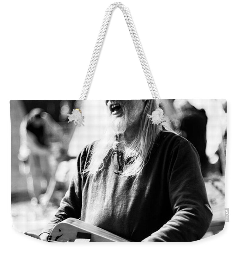 Song Weekender Tote Bag featuring the photograph Singing A Dirge. There Are So Many by Aleck Cartwright