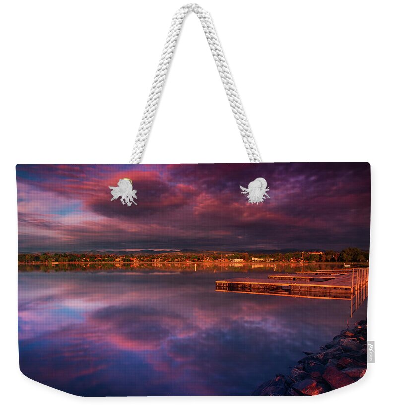 Edgewater Weekender Tote Bag featuring the photograph Skies Of Golden Hour by John De Bord