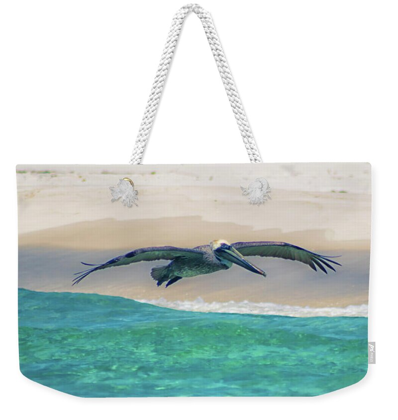 Florida Pelican Weekender Tote Bag featuring the photograph Skimming The Shore by Debra Forand