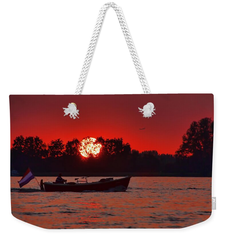 Netherlands Weekender Tote Bag featuring the photograph Sky on Fire by Nadia Sanowar
