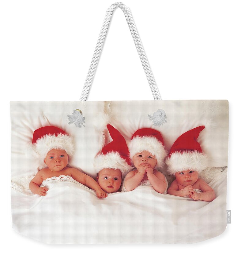 Holiday Weekender Tote Bag featuring the photograph Sleepy Santas by Anne Geddes