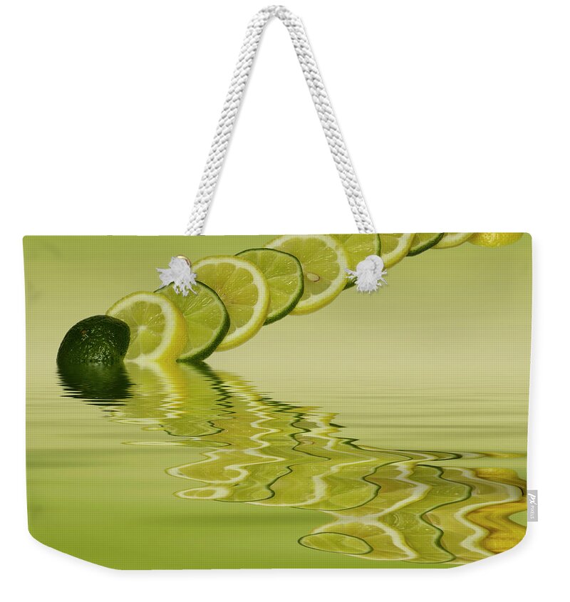 Fresh Fruit Weekender Tote Bag featuring the photograph Slices Lemon Lime Citrus Fruit by David French