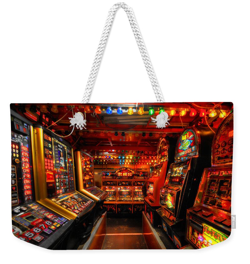  Yhun Suarez Weekender Tote Bag featuring the photograph Slot Machines by Yhun Suarez