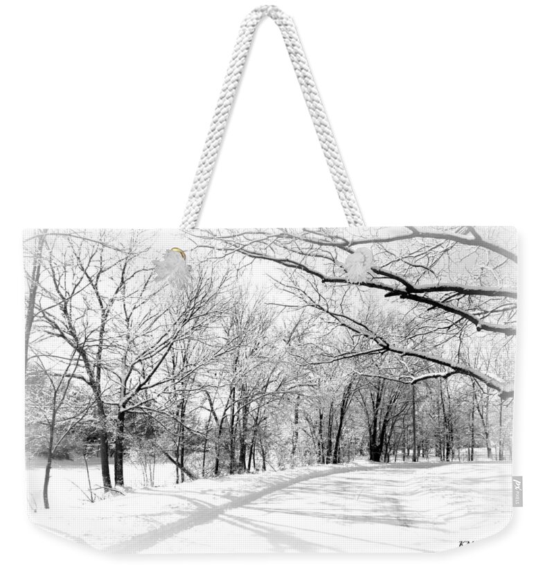 Snow Covered River Road Weekender Tote Bag featuring the photograph Snow Covered River Road by Kathy M Krause