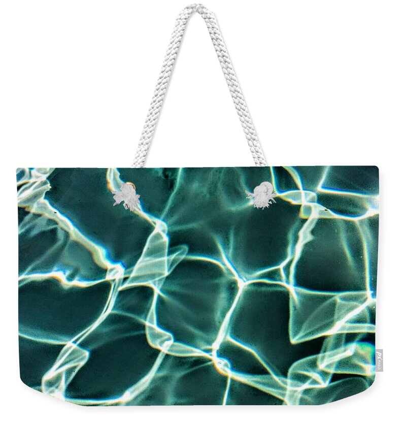  Weekender Tote Bag featuring the photograph Solid by Joel Loftus