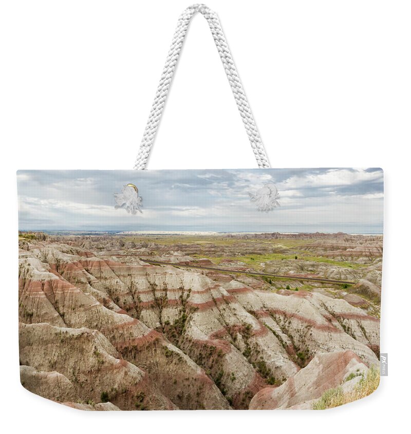 Badlands Weekender Tote Bag featuring the photograph Solitary Road by Karen Jorstad