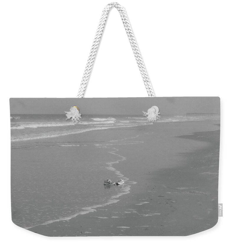 Sneakers Weekender Tote Bag featuring the photograph Solo Sea Shore Sneakers by WaLdEmAr BoRrErO