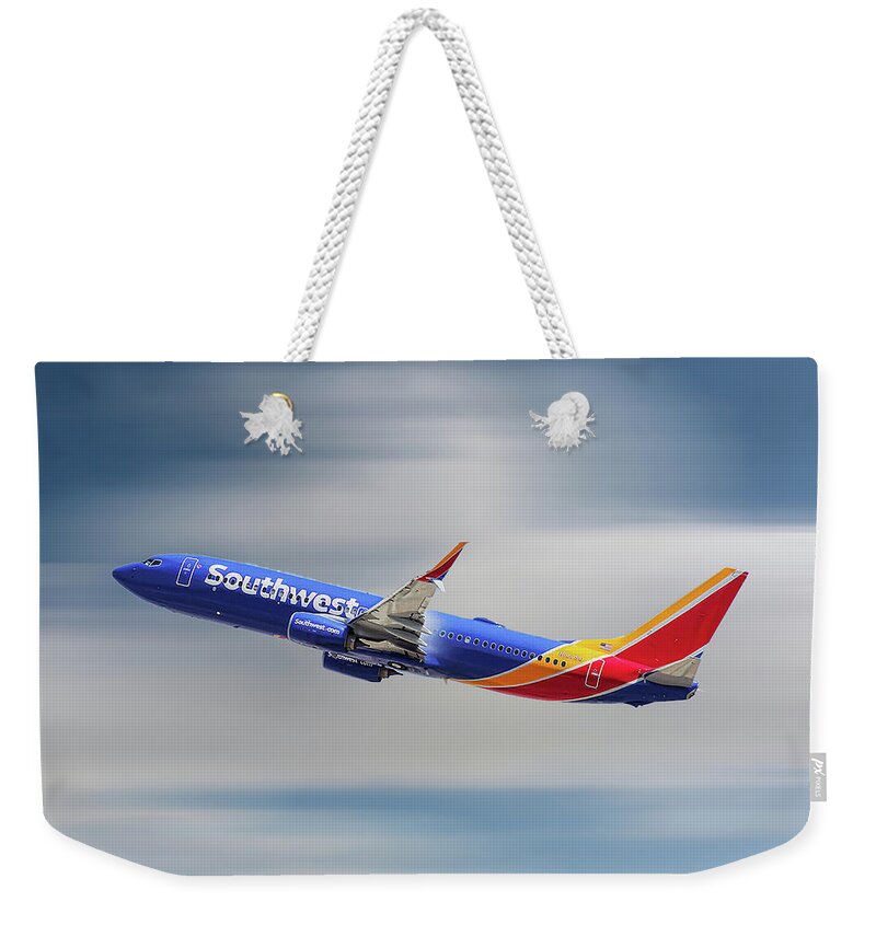 Southwest Weekender Tote Bag featuring the mixed media Southwest Airlines Boeing 737-8H4 by Smart Aviation
