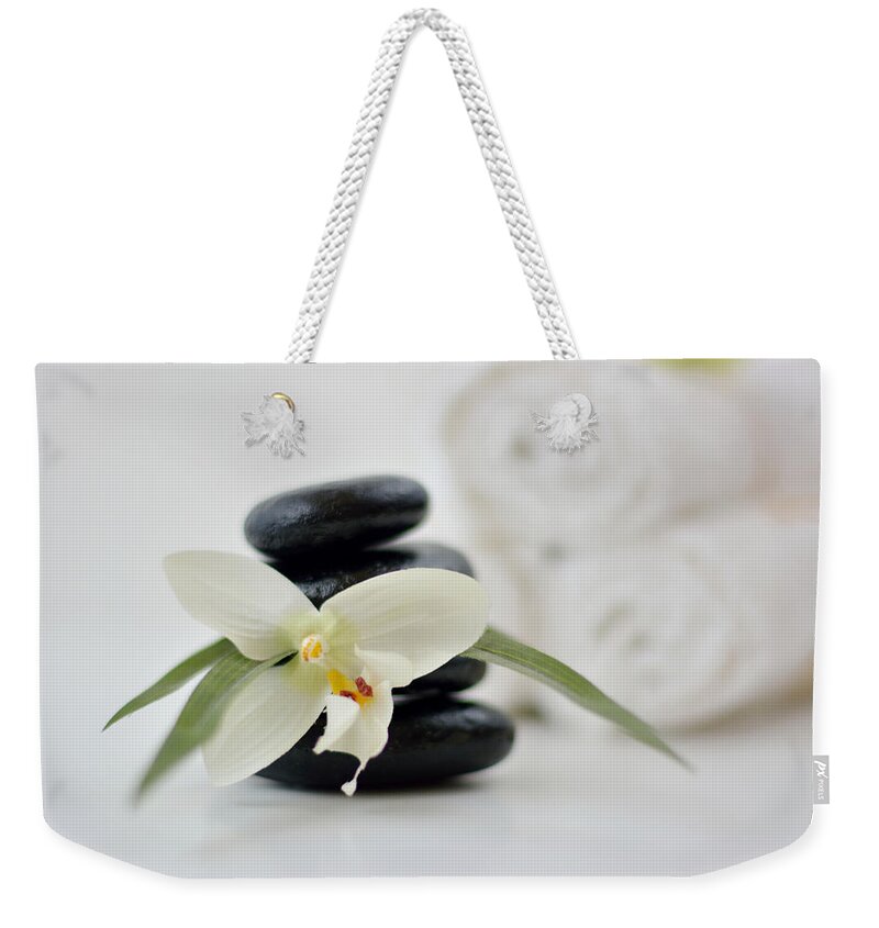 Spa Weekender Tote Bag featuring the photograph Spa Stones And Flower by Serena King