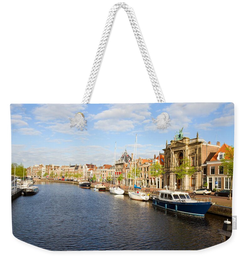 Haarlem Weekender Tote Bag featuring the photograph Spaarne and Haarlem by Anastasy Yarmolovich