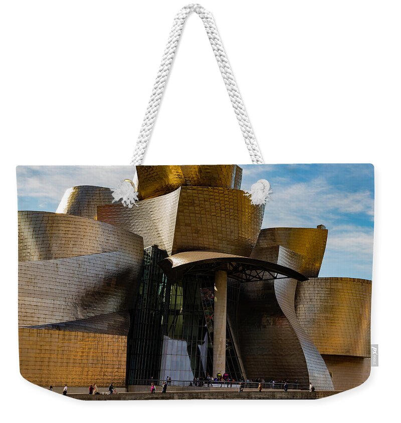 Spain Bilbao Guggenheim Museum Basque Country Frank Gehry Contemporary Architecture Nervion River City Daring And Innovative Curves Building Exterior Spectacular Building Deconstructivism Ferrovial Clad In Glass Weekender Tote Bag featuring the photograph The Guggenheim Museum Spain Bilbao by Andy Myatt