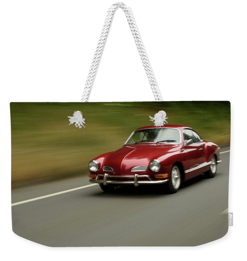 Beetle Weekender Tote Bag featuring the photograph Speeding VW Karmann Ghia by Richard Kimbrough