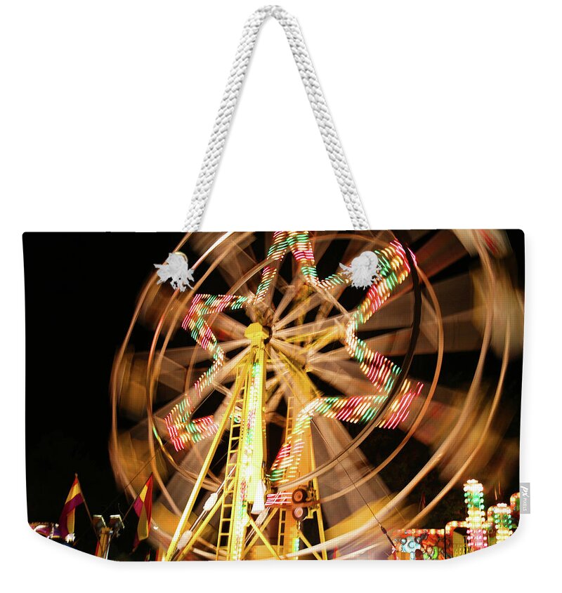 Ferris Wheel Weekender Tote Bag featuring the photograph Spinning by Mary Bedy