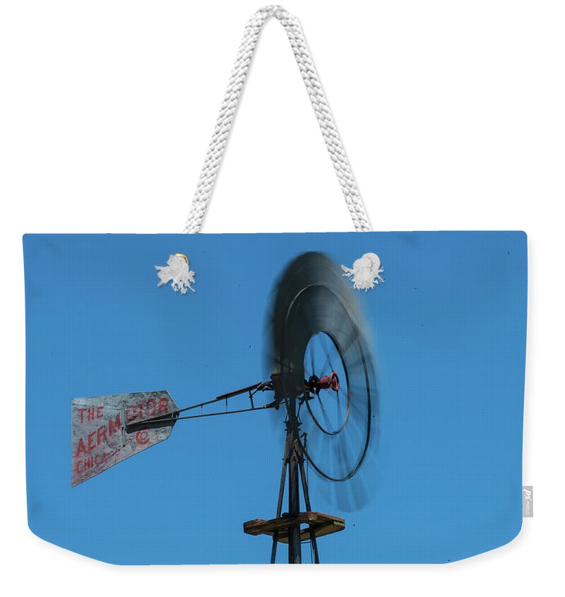 Nevada Weekender Tote Bag featuring the photograph Spinning Windmill Belmont Nevada by Lawrence S Richardson Jr