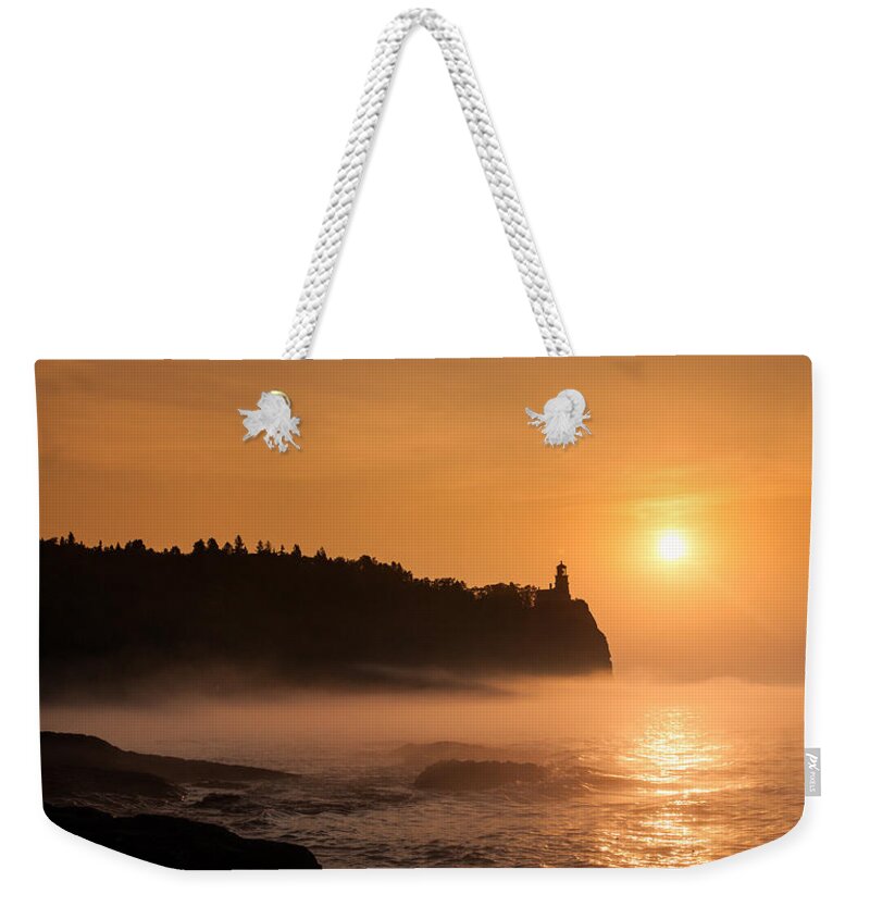 Atmosphere Weekender Tote Bag featuring the photograph Split Rock's Morning Glow by Rikk Flohr