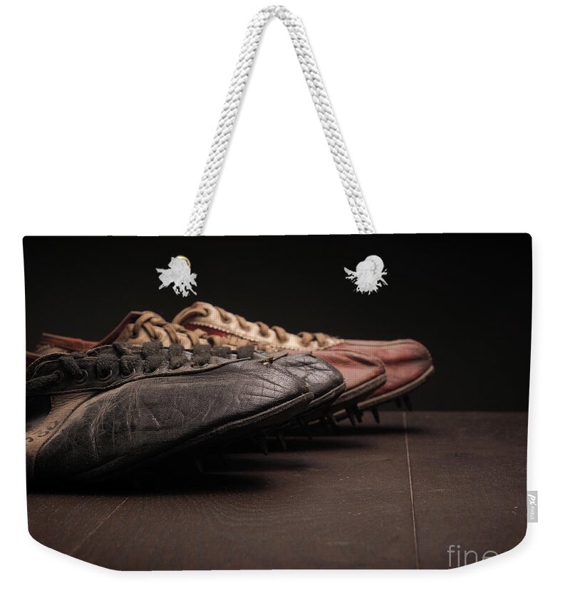 Vintage Weekender Tote Bag featuring the photograph Sport shoes on wood by Andreas Berheide