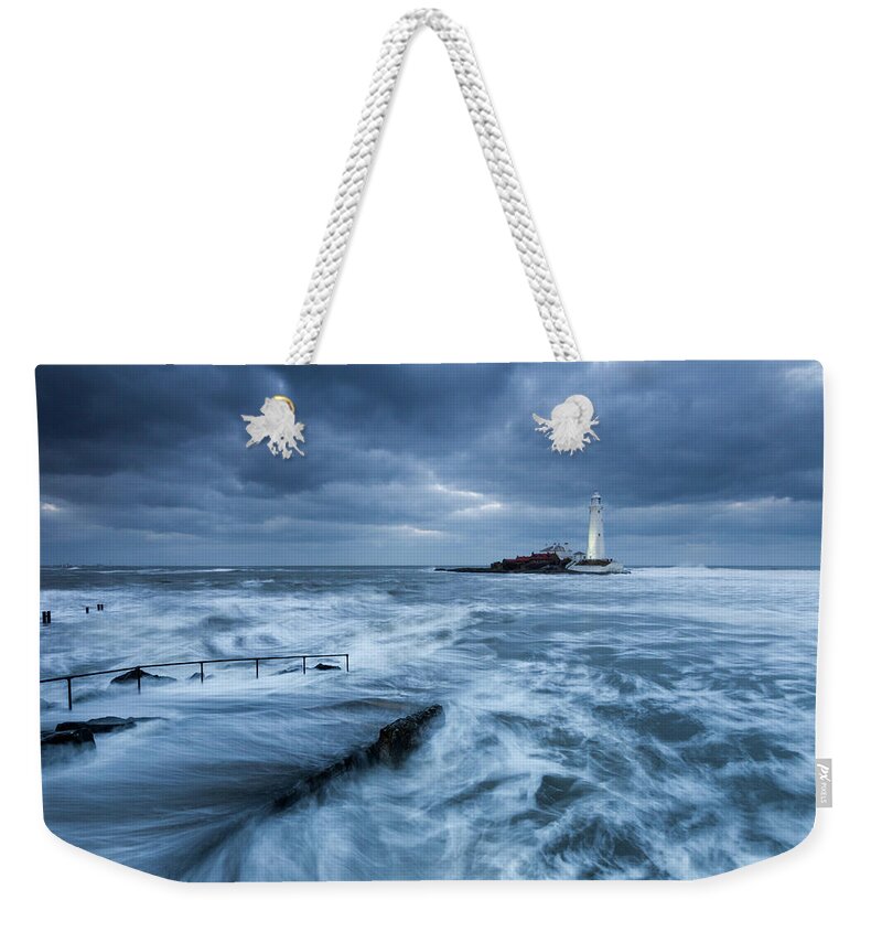 St Mary's Lighthouse Weekender Tote Bag featuring the photograph St Mary's Lighthouse and the cold North Sea by Anita Nicholson