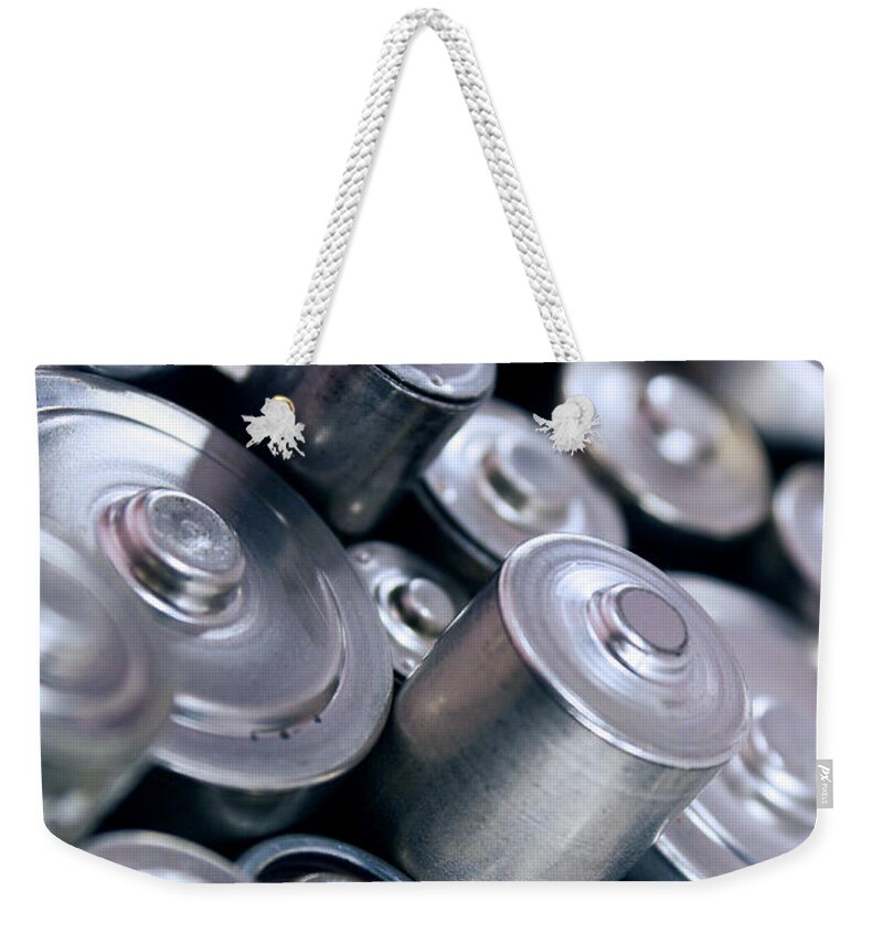 Abstract Weekender Tote Bag featuring the photograph Stack Of Batteries by Carlos Caetano
