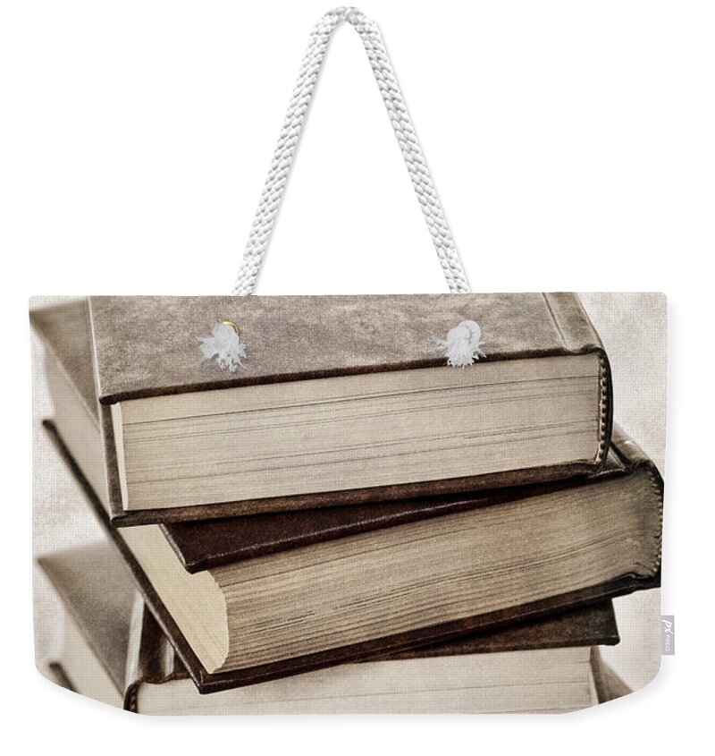 Books Weekender Tote Bag featuring the photograph Stack of books by Elena Elisseeva