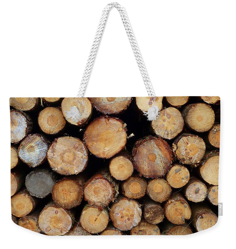 Logs.trees.woodpile.timber Weekender Tote Bag featuring the photograph Stacked Timber Two by Gordon James