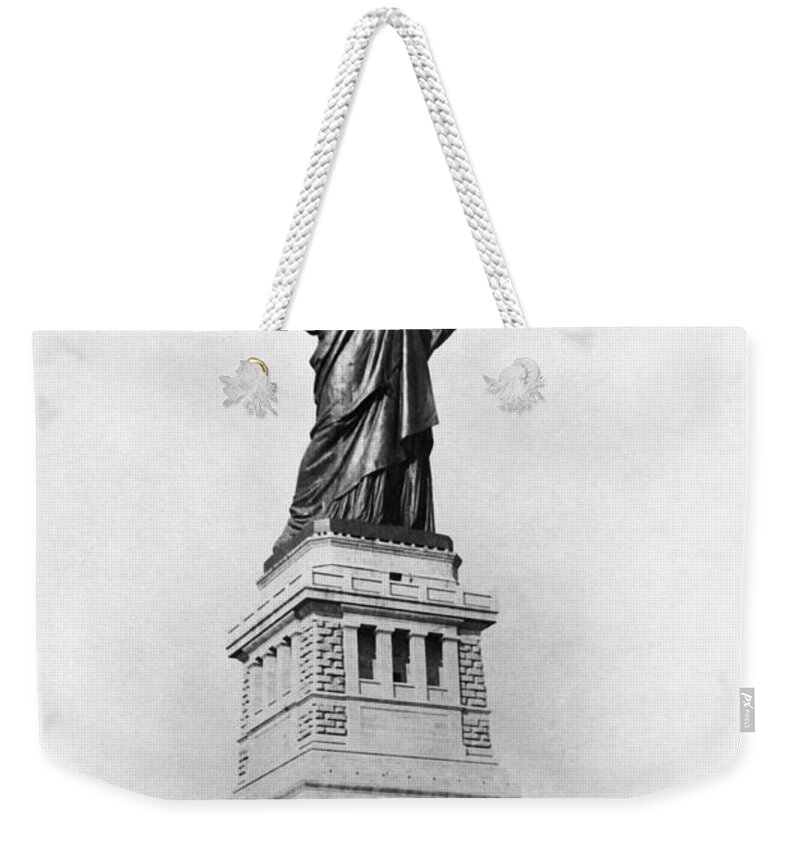 1890 Weekender Tote Bag featuring the photograph STATUE OF LIBERTY, c1890 by Granger