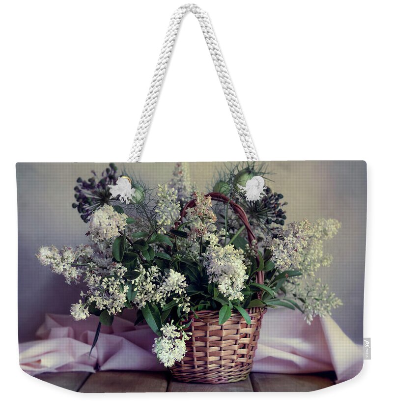 Flowers Weekender Tote Bag featuring the photograph Still life with fresh privet flowers in the basket by Jaroslaw Blaminsky