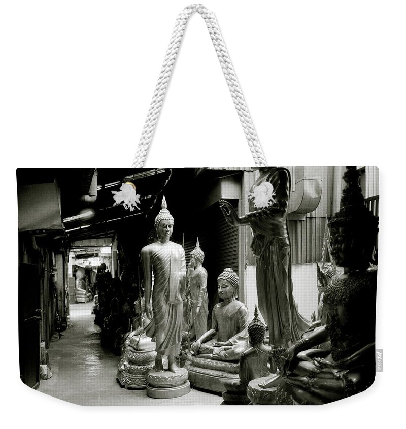 Bangkok Weekender Tote Bag featuring the photograph Stillness Of The Bangkok Buddhas by Shaun Higson