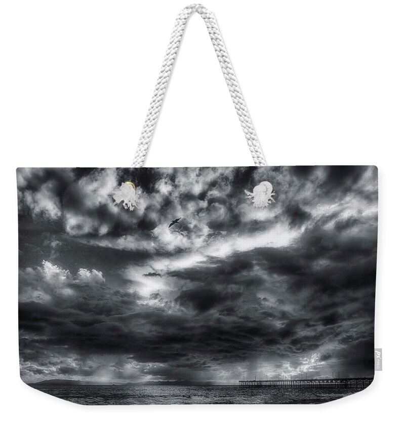 Storm Clouds Weekender Tote Bag featuring the photograph Storm Clouds Ventura CA Pier by John A Rodriguez