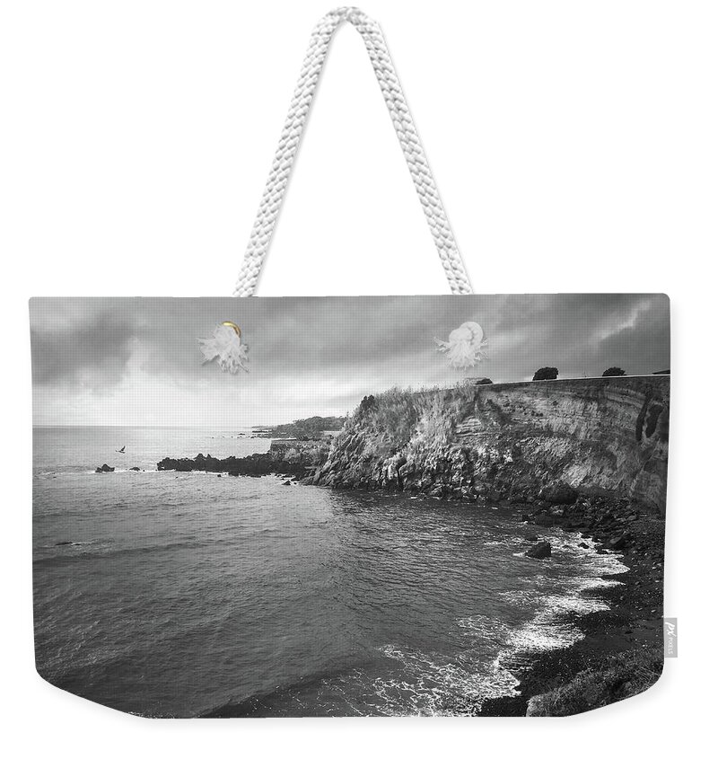 Kelly Hazel Weekender Tote Bag featuring the photograph Storm Over the Eastern Shoreline of Angra do Heroismo Terceira by Kelly Hazel