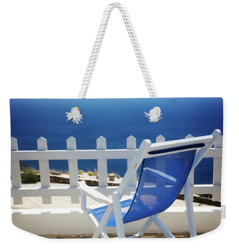 Santorini Weekender Tote Bag featuring the photograph Summer Relax at Santorini by Anastasy Yarmolovich