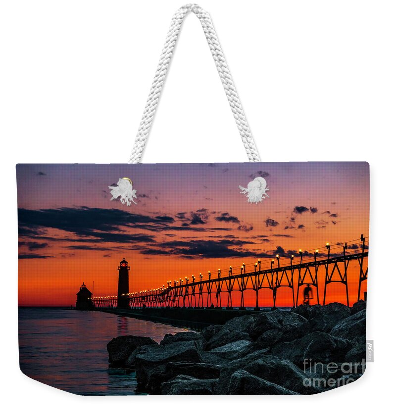 Grand Haven Weekender Tote Bag featuring the photograph Sun Down at Grand Haven Light by Nick Zelinsky Jr