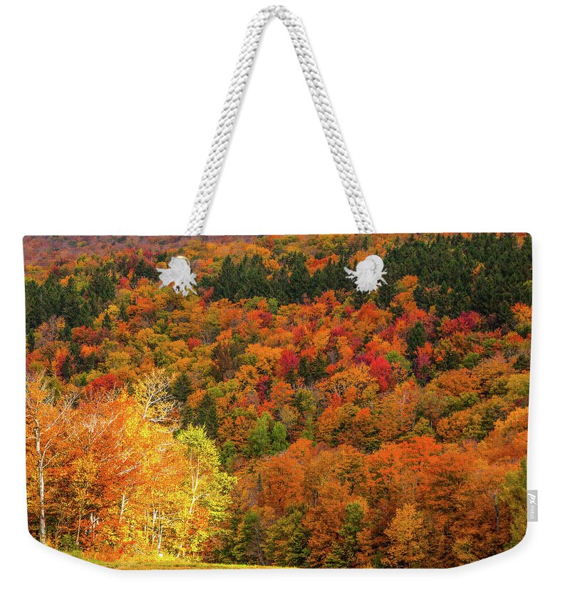 Middlebury Vermont Weekender Tote Bag featuring the photograph Sun peeking through by Jeff Folger