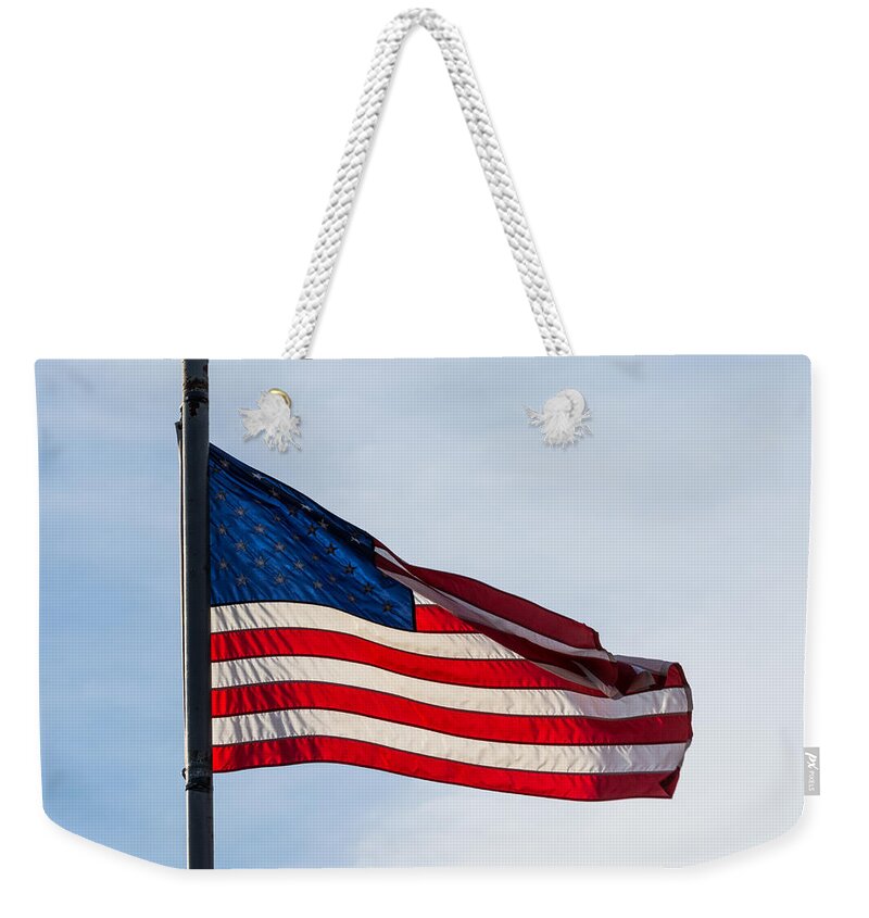 Sunlit Weekender Tote Bag featuring the photograph Sunlit Flag by Holden The Moment