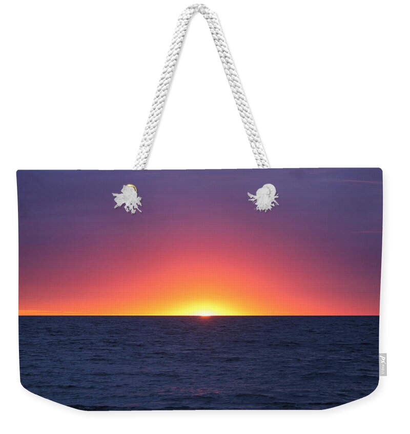 Water Weekender Tote Bag featuring the photograph Sunrise Arch Of Colors by Robert Banach