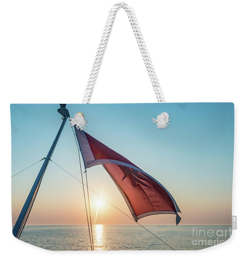Aegis Weekender Tote Bag featuring the photograph Sunrise At The Horizont by Hannes Cmarits