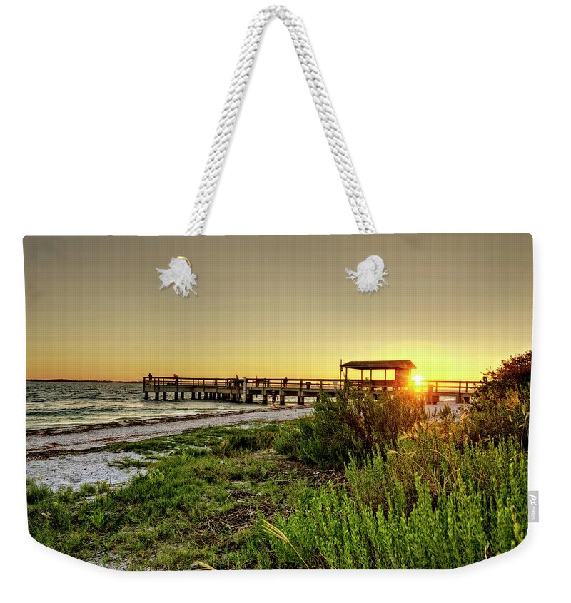 Sanibel Island Weekender Tote Bag featuring the photograph Sunrise At The Sanibel Island Pier by Greg and Chrystal Mimbs