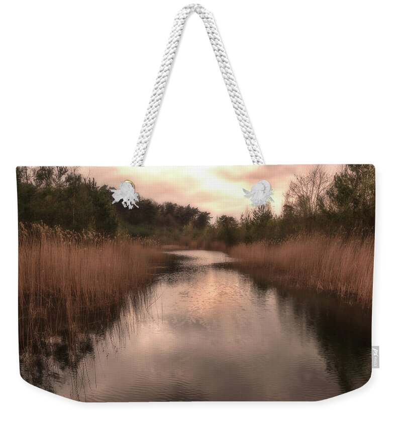 Grass Weekender Tote Bag featuring the photograph Sunset at the sandpit in Maarn by Tim Abeln