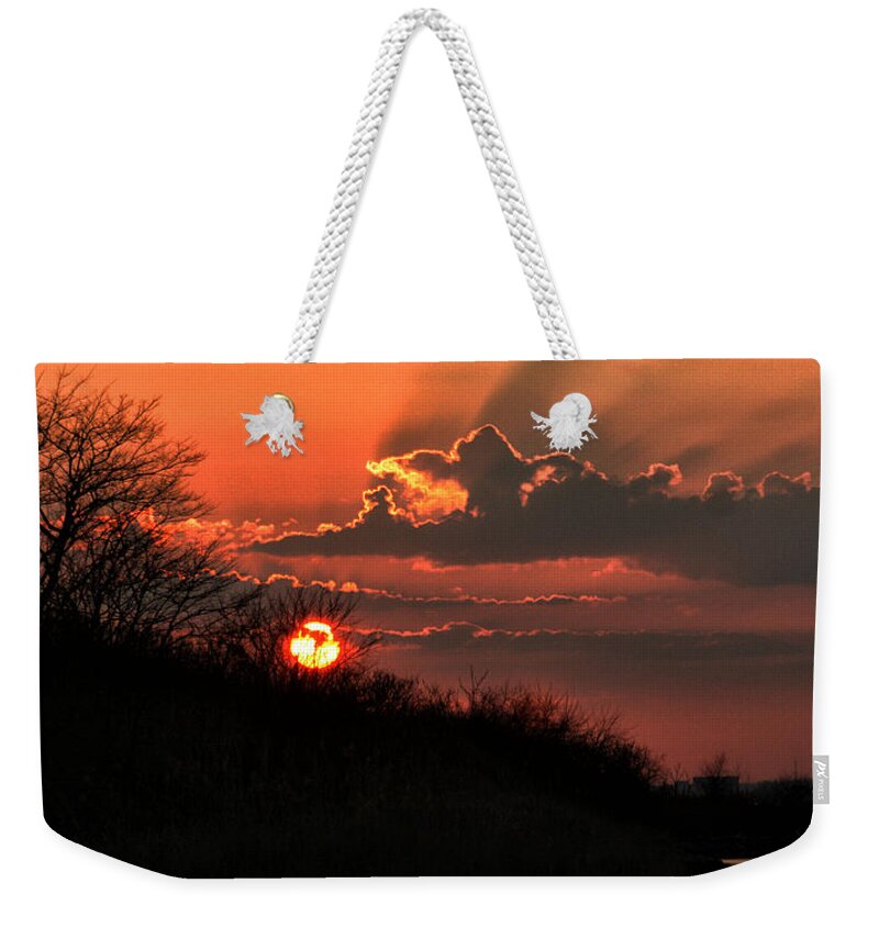 Sun Weekender Tote Bag featuring the photograph Sunset Behind a Knoll by William Selander