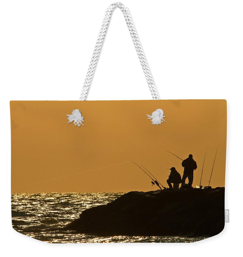 Sunset Weekender Tote Bag featuring the photograph Sunset Fishermen by David Freuthal