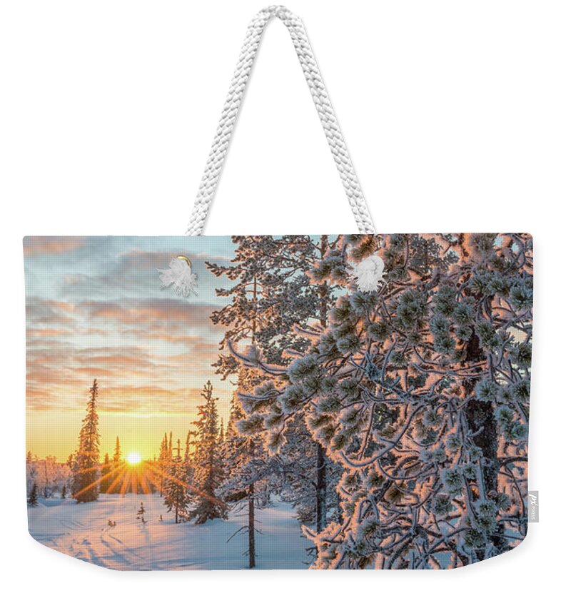 Winter Weekender Tote Bag featuring the photograph Snowy landscape at sunset in Lapland by Delphimages Photo Creations