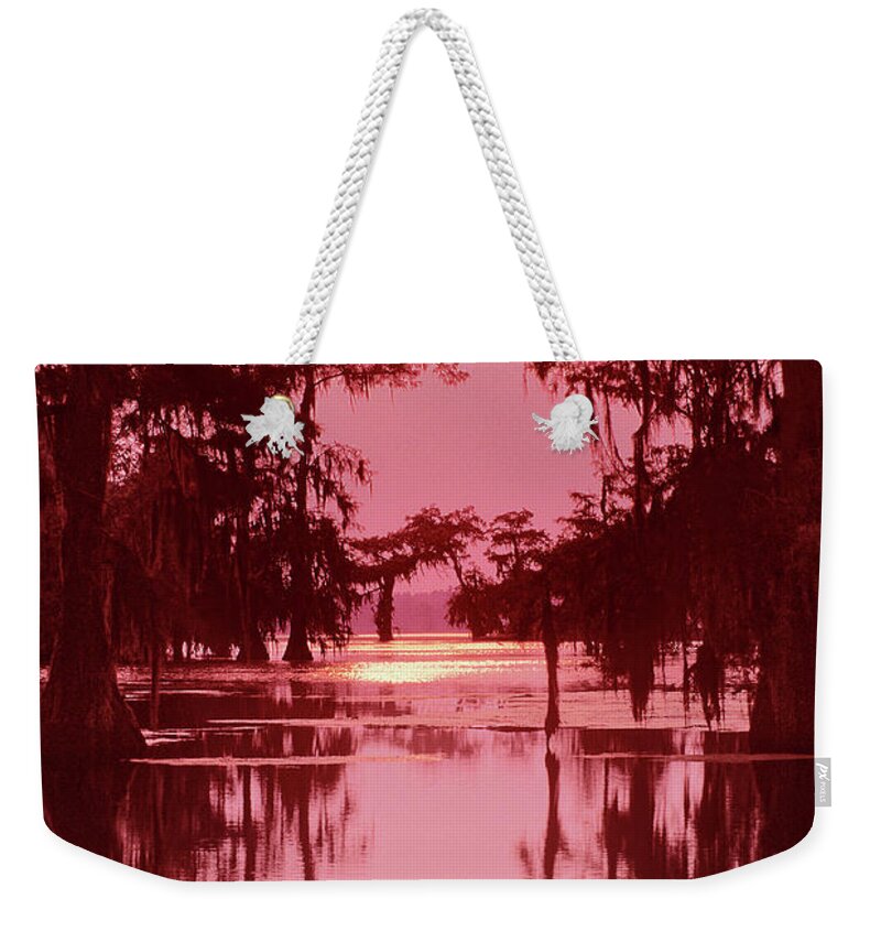 North America Weekender Tote Bag featuring the photograph Sunset on the Bayou Atchafalaya Basin Louisiana by Dave Welling