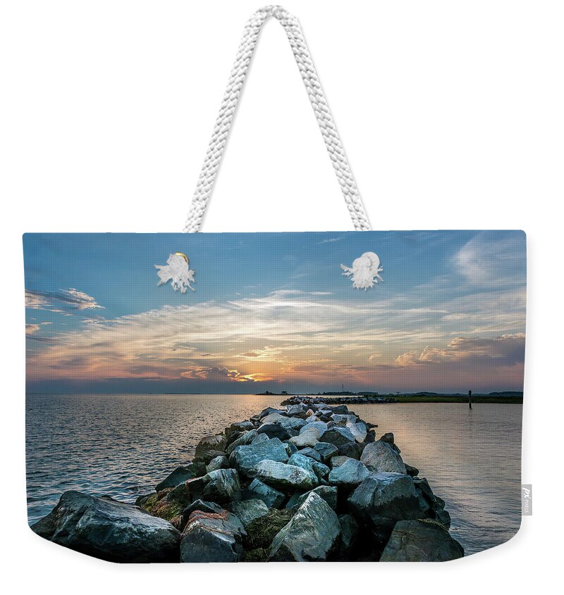 Rocks Weekender Tote Bag featuring the photograph Sunset over a rock jetty on the Chesapeake Bay by Patrick Wolf