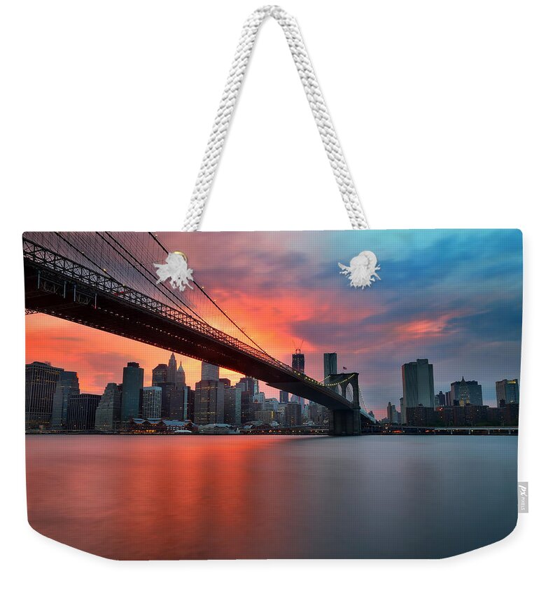 Sunset Weekender Tote Bag featuring the photograph Sunset over Manhattan by Larry Marshall