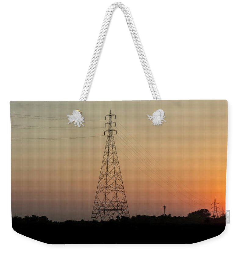 Chriscousins Weekender Tote Bag featuring the photograph Sunset Pylons by Chris Cousins