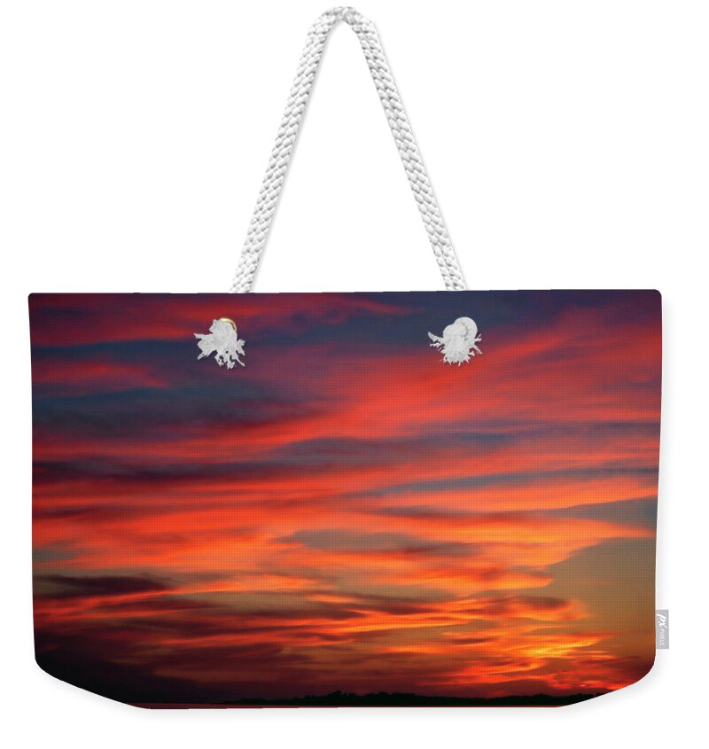 Sunset Over Water Weekender Tote Bag featuring the photograph Sunset Sky by Sally Weigand