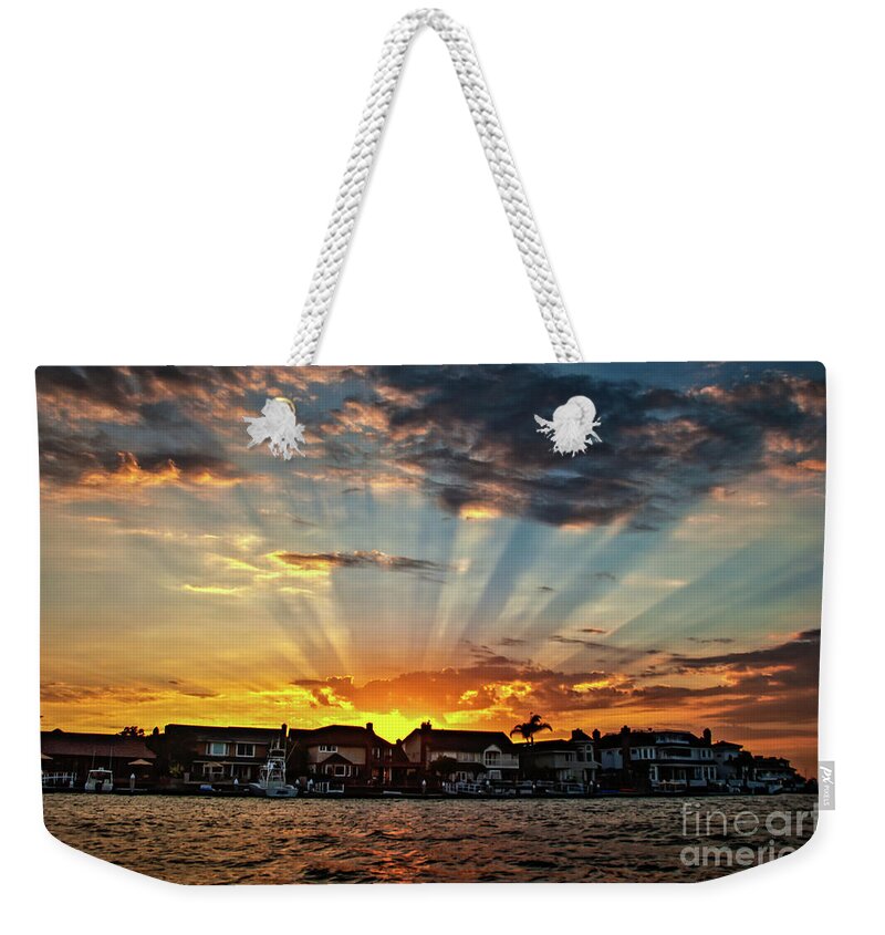 Sun Rays Weekender Tote Bag featuring the photograph Sunset Sunrays over Huntington Harbour by Peter Dang