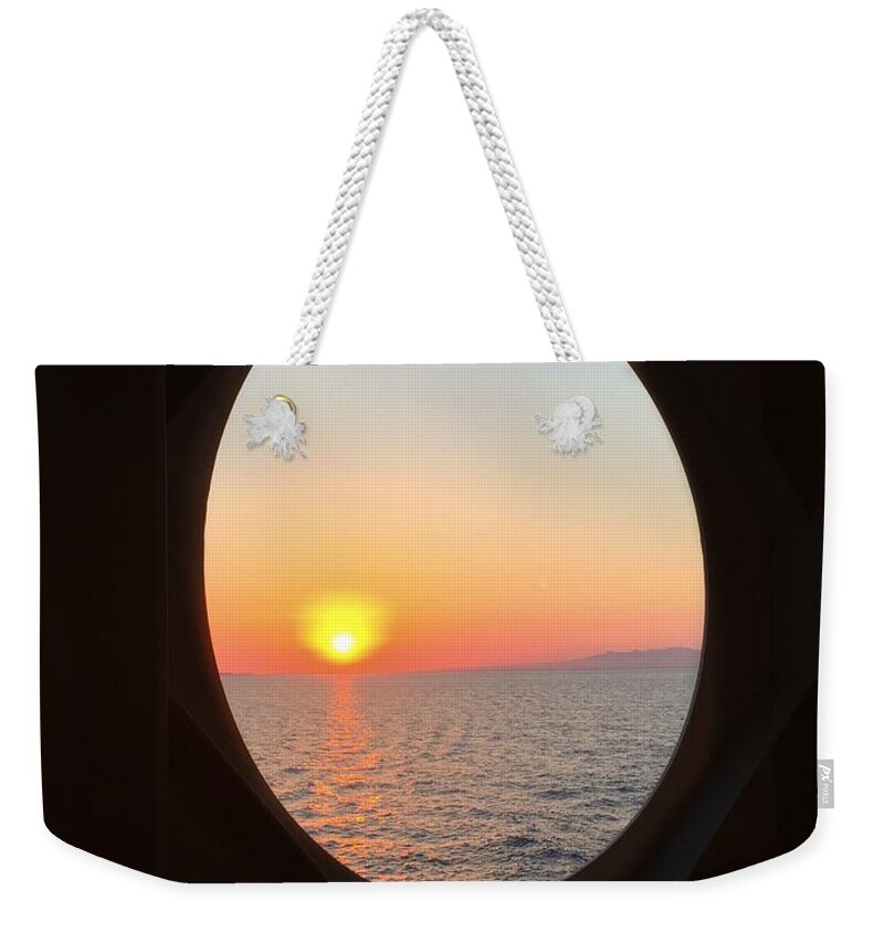 Sunset Through A Porthole Weekender Tote Bag featuring the photograph Sunset through a Porthole by Mark Taylor